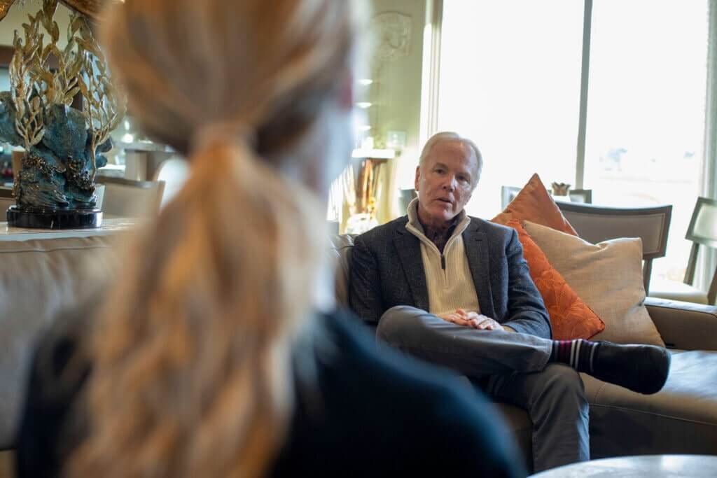 Michael listening to a patient